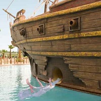 Resort swimming pool with pirate ship waterslide